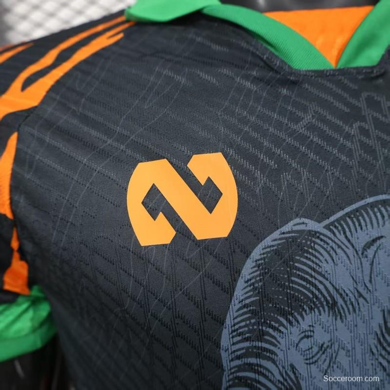 Player Version 2025 Ivory Coast Black with Elephant Graphic and Orange Stripes Jersey